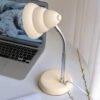 Đèn bàn cổ ngỗng màu kem pastel phong cách retro tối giản. Thiết kế thân uốn dẻo linh hoạt, chụp đèn lượn sóng độc đáo. Phù hợp decor bàn làm việc, phòng ngủ. Khám phá ngay tại Co-Home Decor để làm mới không gian của bạn.